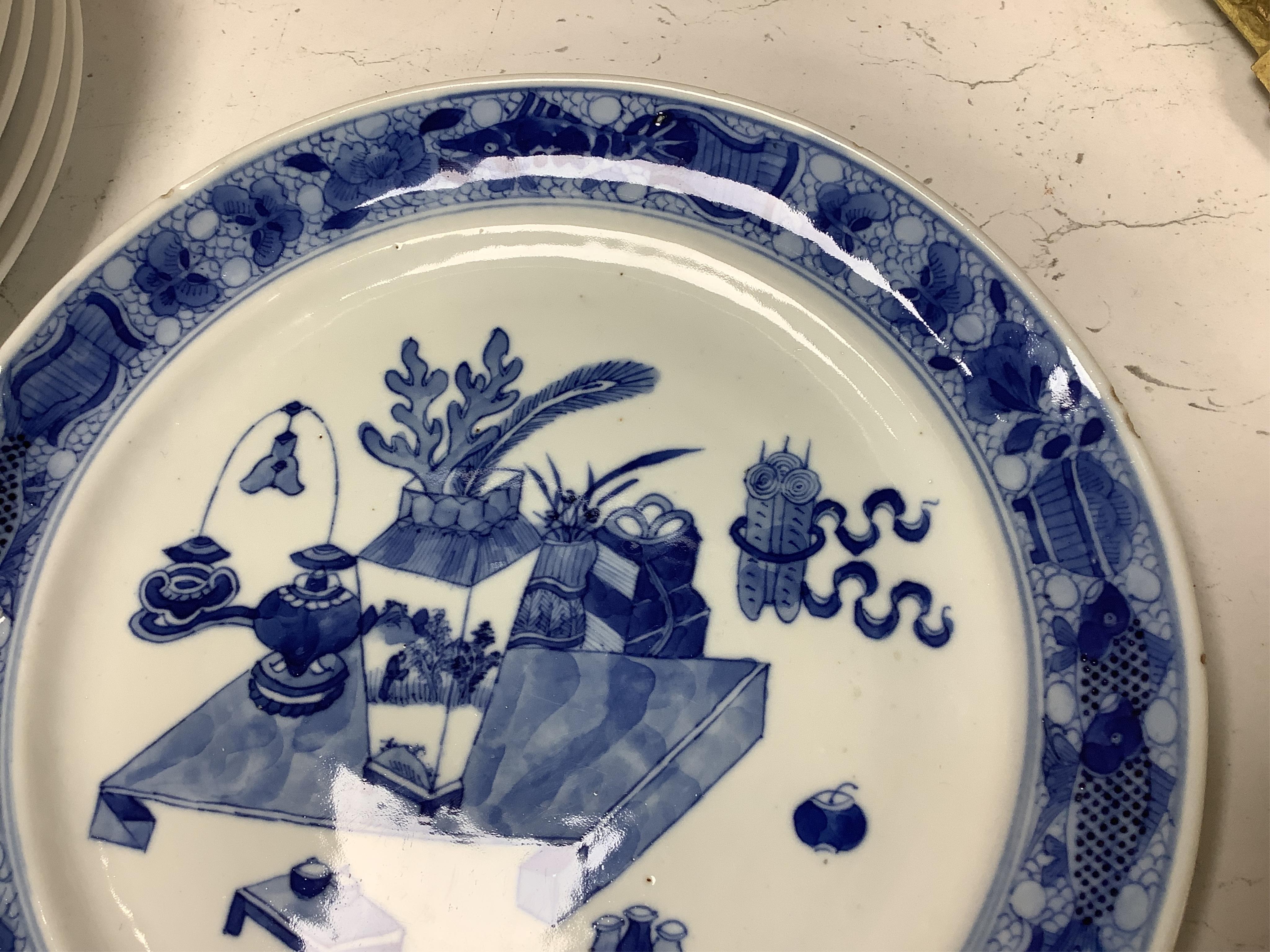 A 19th Century Chinese blue and white ‘precious objects’ plate, a jar and famille rose saucer, largest 23cm in diameter
